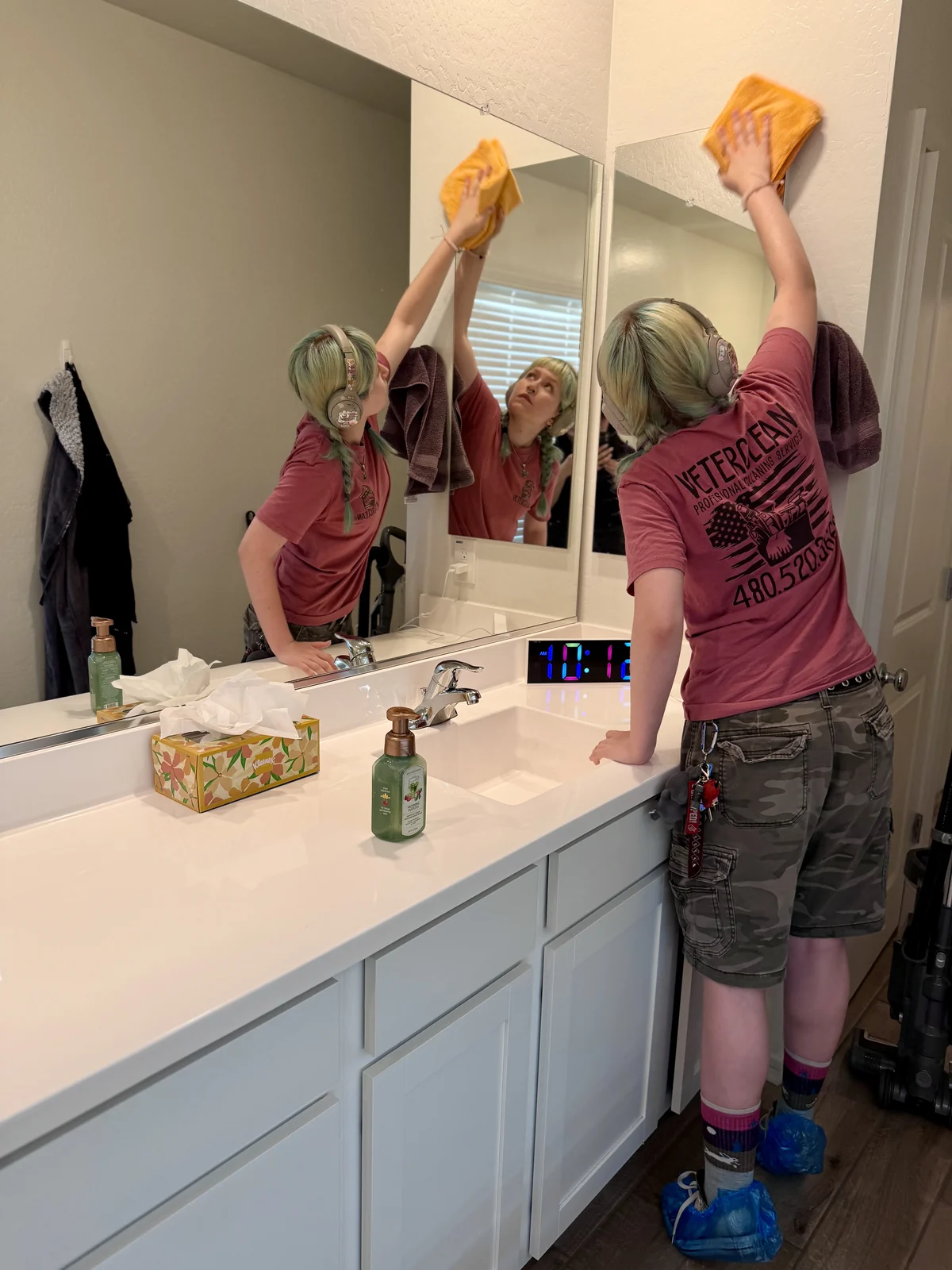 Two VeterClean cleaners finishing a bathroom in an East Valley home