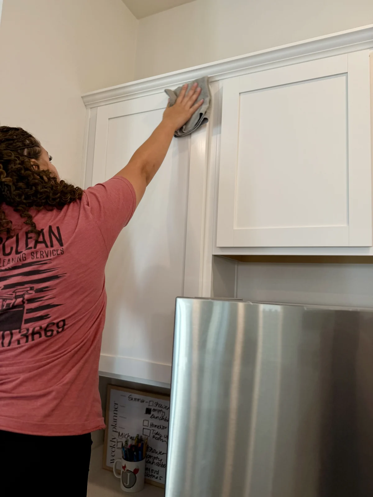 Veteran-owned cleaning team detailing kitchen cabinets in Mesa AZ