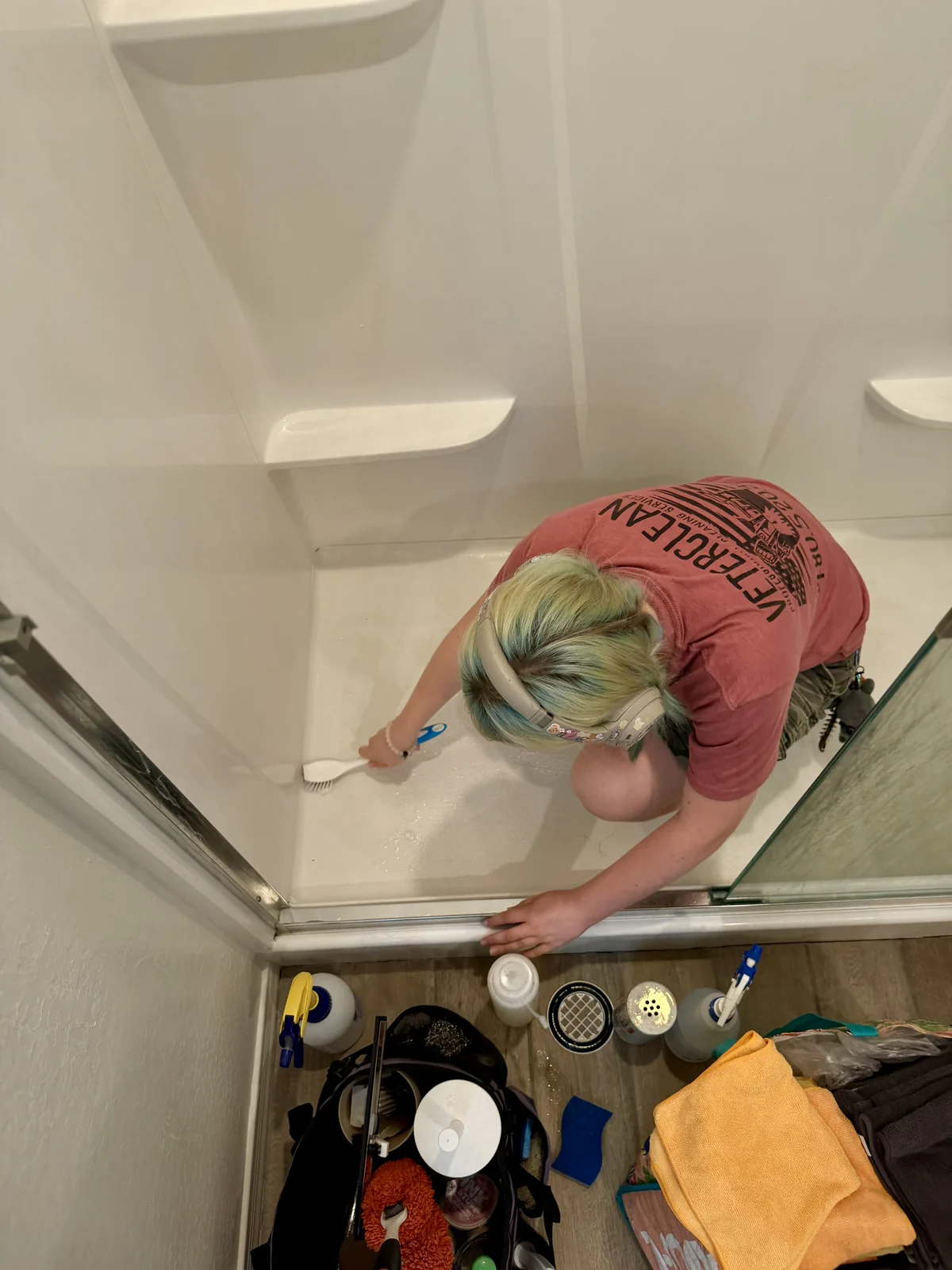 Deep cleaning a shower door track with natural products in Gilbert AZ